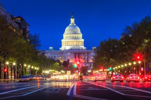 Photo of Washington, D.C. Capital Building at night from the street with street lights on