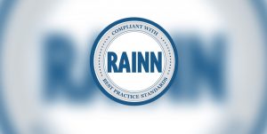 RAINN Logo on blurry background.